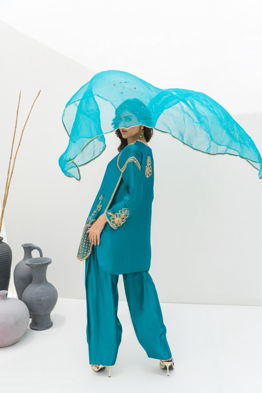 A serene sea green ensemble crafted in Pure Sheesha Silk